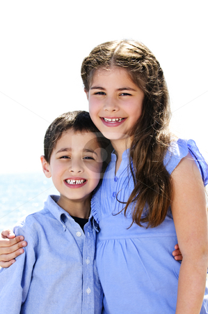To use this stock image in your creative project, please select the size you need over to the right and click the "Add to Cart" button.
Your downloaded image will come with the Cutcaster watermark removed so don’t worry about the watermark you see on this page. Brother and sister hugging stock photo, Portrait of siblings standing and hugging near lake by Elena Elisseeva