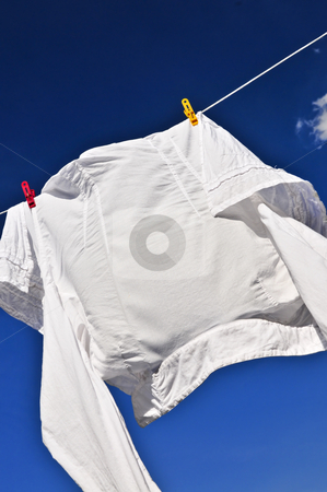 To use this stock image in your creative project, please select the size you need over to the right and click the "Add to Cart" button.
Your downloaded image will come with the Cutcaster watermark removed so don’t worry about the watermark you see on this page. White shirt on clothes line stock photo, White shirt hanging to dry on clothes line by Elena Elisseeva