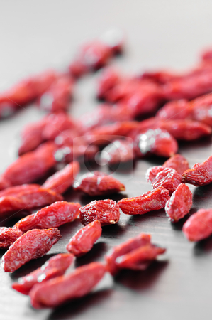 To use this stock image in your creative project, please select the size you need over to the right and click the "Add to Cart" button.
Your downloaded image will come with the Cutcaster watermark removed so don’t worry about the watermark you see on this page. Goji berries stock photo, Scattered red dried goji berries on a table by Elena Elisseeva