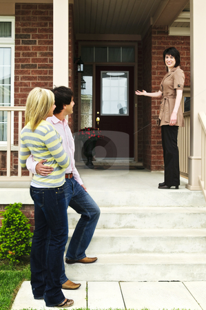 To use this stock image in your creative project, please select the size you need over to the right and click the "Add to Cart" button.
Your downloaded image will come with the Cutcaster watermark removed so don’t worry about the watermark you see on this page. Happy couple with real estate agent stock photo, Real estate agent with couple welcoming to new home by Elena Elisseeva