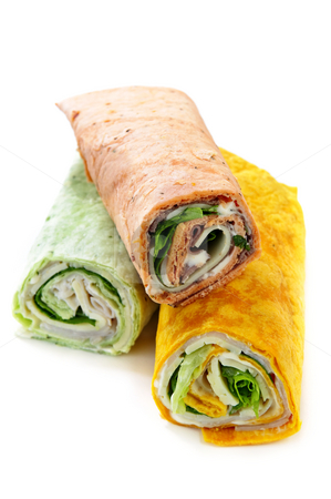 To use this stock image in your creative project, please select the size you need over to the right and click the "Add to Cart" button.
Your downloaded image will come with the Cutcaster watermark removed so don’t worry about the watermark you see on this page. Wrap sandwiches stock photo, Three isolated multicolored tortilla wraps with meat and vegetables by Elena Elisseeva