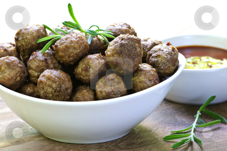 To use this stock image in your creative project, please select the size you need over to the right and click the "Add to Cart" button.
Your downloaded image will come with the Cutcaster watermark removed so don’t worry about the watermark you see on this page. Meatballs and sauce stock photo, Fresh hot meatball appetizers served in white bowl with dipping sauce by Elena Elisseeva