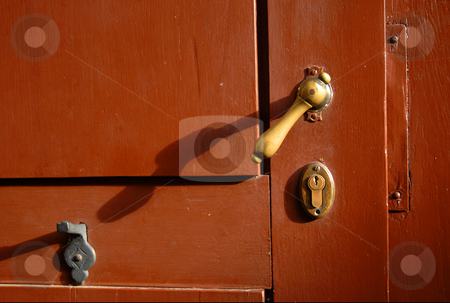 To use this stock image in your creative project, please select the size you need over to the right and click the "Add to Cart" button.
Your downloaded image will come with the Cutcaster watermark removed so don’t worry about the watermark you see on this page. Bronce latch of a red door stock photo, Bronce latch of a red wooden door by Cienpies Design