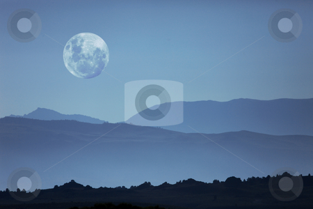 To use this stock image in your creative project, please select the size you need over to the right and click the "Add to Cart" button.
Your downloaded image will come with the Cutcaster watermark removed so don’t worry about the watermark you see on this page. Ghostly Mountain Silhouettes and Moon stock photo, Beautiful Ghostly Mountain Silhouettes and Moon Moonscape by Katrina Brown