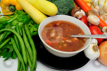 To use this stock image in your creative project, please select the size you need over to the right and click the "Add to Cart" button.
Your downloaded image will come with the Cutcaster watermark removed so don’t worry about the watermark you see on this page. Vegetable soup stock photo, Hot vegetable soup with a sprig of basil served in a white bow by Lynn Bendickson