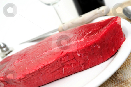 To use this stock image in your creative project, please select the size you need over to the right and click the "Add to Cart" button.
Your downloaded image will come with the Cutcaster watermark removed so don’t worry about the watermark you see on this page. Steak stock photo, Close-up of a a large raw beef steak served on a white plate by Lynn Bendickson