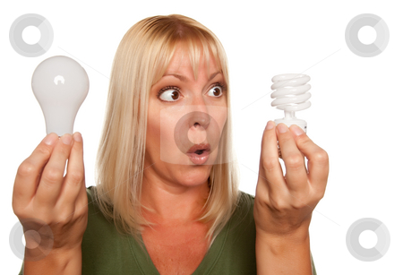To use this stock image in your creative project, please select the size you need over to the right and click the "Add to Cart" button.
Your downloaded image will come with the Cutcaster watermark removed so don’t worry about the watermark you see on this page. Funny Woman Holding Energy Saving and Regular Light Bulbs stock photo, Funny Faced Woman Holds Energy Saving and Regular Light Bulbs Isolated on a White Background. by Andy Dean
