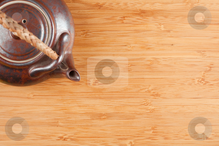 To use this stock image in your creative project, please select the size you need over to the right and click the "Add to Cart" button.
Your downloaded image will come with the Cutcaster watermark removed so don’t worry about the watermark you see on this page. Tea Pot and Bamboo Textured Surface stock photo, Tea Pot and Bamboo Textured Surface Background with Plenty of Room for Text. Focus is on the Bamboo Surface. by Andy Dean