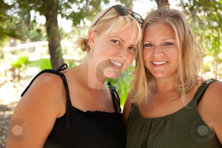To use this stock image in your creative project, please select the size you need over to the right and click the "Add to Cart" button.
Your downloaded image will come with the Cutcaster watermark removed so don’t worry about the watermark you see on this page. Two Beautiful Smiling Sisters Ourdoor Portrait stock photo, Two Beautiful Smiling Sisters in the Outdoors Portrait. by Andy Dean