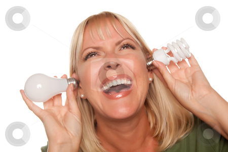 To use this stock image in your creative project, please select the size you need over to the right and click the "Add to Cart" button.
Your downloaded image will come with the Cutcaster watermark removed so don’t worry about the watermark you see on this page. Funny Woman Holding Energy Saving and Regular Light Bulbs to Her stock photo, Funny Faced Woman Holds Energy Saving and Regular Light Bulbs to Her Ears Isolated on a White Background. by Andy Dean