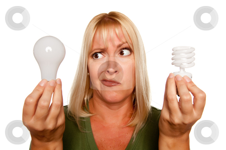 To use this stock image in your creative project, please select the size you need over to the right and click the "Add to Cart" button.
Your downloaded image will come with the Cutcaster watermark removed so don’t worry about the watermark you see on this page. Funny Woman Holding Energy Saving and Regular Light Bulbs stock photo, Funny Faced Woman Holds Energy Saving and Regular Light Bulbs Isolated on a White Background. by Andy Dean