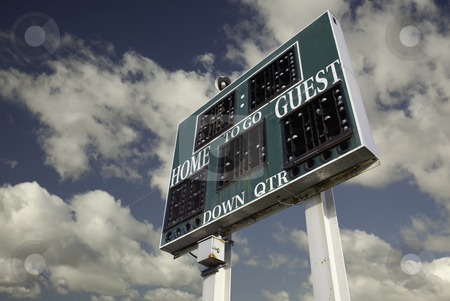 To use this stock image in your creative project, please select the size you need over to the right and click the "Add to Cart" button.
Your downloaded image will come with the Cutcaster watermark removed so don’t worry about the watermark you see on this page. HIgh School Scoreboard stock photo, HIgh School Scoreboard with a Beautiful Sky and Clouds Background. by Andy Dean