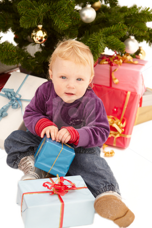 To use this stock image in your creative project, please select the size you need over to the right and click the "Add to Cart" button.
Your downloaded image will come with the Cutcaster watermark removed so don’t worry about the watermark you see on this page. Cute little girl opening christmas gifts stock photo, Cute little girl opening christmas gifts under a tree by Phillip Dyhr Hobbs