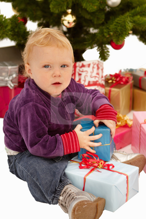 To use this stock image in your creative project, please select the size you need over to the right and click the "Add to Cart" button.
Your downloaded image will come with the Cutcaster watermark removed so don’t worry about the watermark you see on this page. Christmas - Child caught opening gifts under tree stock photo, Christmas - Child caught opening x-mas gifts under tree by Phillip Dyhr Hobbs