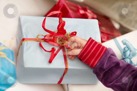 To use this stock image in your creative project, please select the size you need over to the right and click the "Add to Cart" button.
Your downloaded image will come with the Cutcaster watermark removed so don’t worry about the watermark you see on this page. Christmas time - opening of presents stock photo, Christmas time - opening of gifts by Phillip Dyhr Hobbs