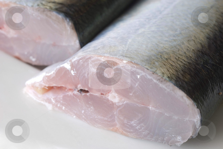 To use this stock image in your creative project, please select the size you need over to the right and click the "Add to Cart" button.
Your downloaded image will come with the Cutcaster watermark removed so don’t worry about the watermark you see on this page. Fish Fillet stock photo, A fresh fish sliced in half ready for filleting by Stephen Gibson
