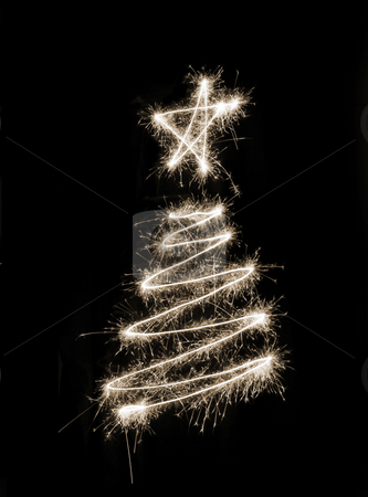 To use this stock image in your creative project, please select the size you need over to the right and click the "Add to Cart" button.
Your downloaded image will come with the Cutcaster watermark removed so don’t worry about the watermark you see on this page. Sparkling Xmas Tree stock photo, A christmas tree symbol drawn in sparkler trails by Stephen Gibson
