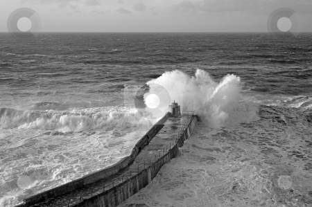 To use this stock image in your creative project, please select the size you need over to the right and click the "Add to Cart" button.
Your downloaded image will come with the Cutcaster watermark removed so don’t worry about the watermark you see on this page. Big Atlantic wave breaks on Portreath pier, Cornwall UK. stock photo, Big Atlantic wave breaks on Portreath pier, Cornwall UK. by Stephen Rees
