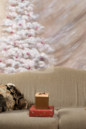To use this stock image in your creative project, please select the size you need over to the right and click the "Add to Cart" button.
Your downloaded image will come with the Cutcaster watermark removed so don’t worry about the watermark you see on this page. Christmas Gifts stock photo, Two Christmas gifts lying on a sofa with a hand painted Christmas tree in the background by Richard Nelson