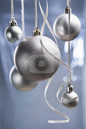 To use this stock image in your creative project, please select the size you need over to the right and click the "Add to Cart" button.
Your downloaded image will come with the Cutcaster watermark removed so don’t worry about the watermark you see on this page. Christmas ornaments stock photo, Group of silver Christmas ornament with bluish background by Rudyanto Wijaya
