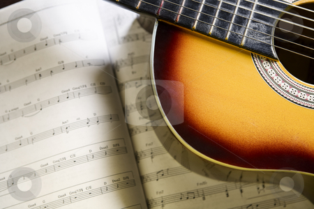 To use this stock image in your creative project, please select the size you need over to the right and click the "Add to Cart" button.
Your downloaded image will come with the Cutcaster watermark removed so don’t worry about the watermark you see on this page. Classic guitar and music chords stock photo, Classic guitar on top of music chords by Rudyanto Wijaya