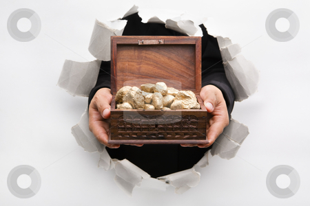 To use this stock image in your creative project, please select the size you need over to the right and click the "Add to Cart" button.
Your downloaded image will come with the Cutcaster watermark removed so don’t worry about the watermark you see on this page. Hand breakthrough wall holding treasure chest full of golden nug stock photo, Hand breakthrough wall holding golden nuggets in treasure chest means breakthrough in finance or similar things - one of the breakthrough series by Rudyanto Wijaya