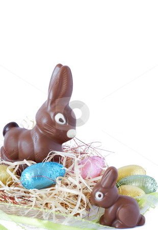 To use this stock image in your creative project, please select the size you need over to the right and click the "Add to Cart" button.
Your downloaded image will come with the Cutcaster watermark removed so don’t worry about the watermark you see on this page. Colorful wrapped chocolate Easter eggs stock photo, Assortment of chocolate Easter eggs wrapped in colorful paper with chocolate bunnies on straw by Elena Weber (nee Talberg)
