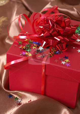 To use this stock image in your creative project, please select the size you need over to the right and click the "Add to Cart" button.
Your downloaded image will come with the Cutcaster watermark removed so don’t worry about the watermark you see on this page. Red gift box with bows and stars stock photo, Red gift box with bows and stars on golden silk background by Elena Weber (nee Talberg)