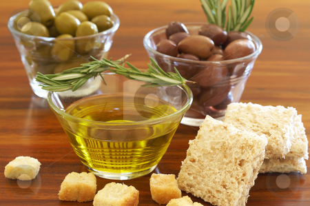 To use this stock image in your creative project, please select the size you need over to the right and click the "Add to Cart" button.
Your downloaded image will come with the Cutcaster watermark removed so don’t worry about the watermark you see on this page. Two jars of green and black olives and croutons stock photo, Two jars of green and black olives with stick of rosemary, croutons and slices of wholewheat bread on wooden table background by Elena Weber (nee Talberg)