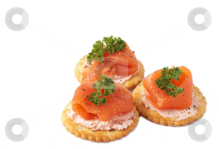 To use this stock image in your creative project, please select the size you need over to the right and click the "Add to Cart" button.
Your downloaded image will come with the Cutcaster watermark removed so don’t worry about the watermark you see on this page. Smoked salmon and cream cheese on crackers stock photo, Smoked salmon and cream cheese on mini crackers with freshly cracked black pepper and garnishing of parsley by Elena Weber (nee Talberg)