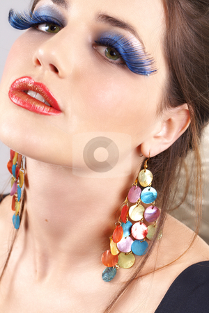 To use this stock image in your creative project, please select the size you need over to the right and click the "Add to Cart" button.
Your downloaded image will come with the Cutcaster watermark removed so don’t worry about the watermark you see on this page. Portrait of beautiful brunette woman stock photo, Portrait of a beautiful young brunette woman with dramatic glamour make-up and fashion earrings by Elena Weber (nee Talberg)