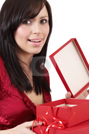 To use this stock image in your creative project, please select the size you need over to the right and click the "Add to Cart" button.
Your downloaded image will come with the Cutcaster watermark removed so don’t worry about the watermark you see on this page. Portrait of beautiful brunette woman stock photo, Portrait of a beautiful young brunette woman opening gift boxes at a celebration by Elena Weber (nee Talberg)