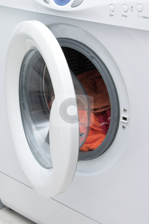 To use this stock image in your creative project, please select the size you need over to the right and click the "Add to Cart" button.
Your downloaded image will come with the Cutcaster watermark removed so don’t worry about the watermark you see on this page. Washing machine stock photo, White washing machine with open door. by Elena Weber (nee Talberg)