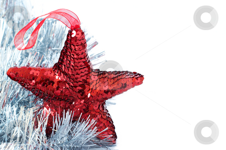 To use this stock image in your creative project, please select the size you need over to the right and click the "Add to Cart" button.
Your downloaded image will come with the Cutcaster watermark removed so don’t worry about the watermark you see on this page. Red shiny star decoration with silver tinsel stock photo, Red shiny Christmas star decoration with silver tinsel on white background by Elena Weber (nee Talberg)