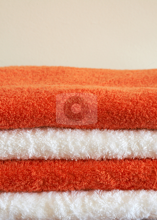 To use this stock image in your creative project, please select the size you need over to the right and click the "Add to Cart" button.
Your downloaded image will come with the Cutcaster watermark removed so don’t worry about the watermark you see on this page. Stack of color towels stock photo, Stack of white and orange fluffy towels on light background by Elena Weber (nee Talberg)