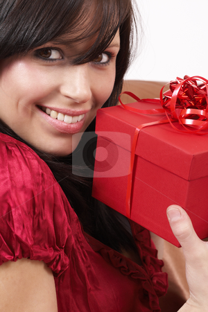 To use this stock image in your creative project, please select the size you need over to the right and click the "Add to Cart" button.
Your downloaded image will come with the Cutcaster watermark removed so don’t worry about the watermark you see on this page. Portrait of beautiful brunette woman stock photo, Portrait of a beautiful young brunette woman holding gift box at a celebration by Elena Weber (nee Talberg)
