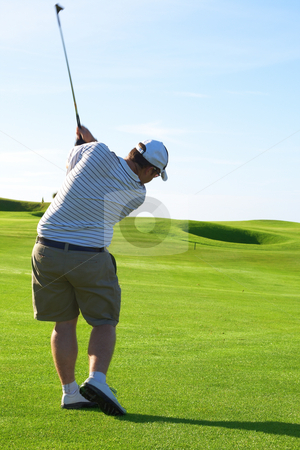 To use this stock image in your creative project, please select the size you need over to the right and click the "Add to Cart" button.
Your downloaded image will come with the Cutcaster watermark removed so don’t worry about the watermark you see on this page. Golfer on the fairway stock photo, Young male golfer hitting the ball from the fairway on a beautiful summer day by Elena Weber (nee Talberg)