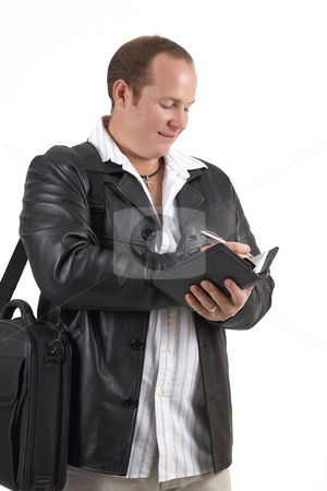 To use this stock image in your creative project, please select the size you need over to the right and click the "Add to Cart" button.
Your downloaded image will come with the Cutcaster watermark removed so don’t worry about the watermark you see on this page. Businessman holding a diary stock photo, Young successful businessman wearing leather jacket writing in his daybook and smiling. Isolated on white background by Elena Weber (nee Talberg)