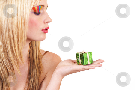 To use this stock image in your creative project, please select the size you need over to the right and click the "Add to Cart" button.
Your downloaded image will come with the Cutcaster watermark removed so don’t worry about the watermark you see on this page. Portrait of beautiful blonde woman stock photo, Portrait of a beautiful blonde woman with light blue eyes and colorful make-up holding small Christmas box isolated on white background by Elena Weber (nee Talberg)