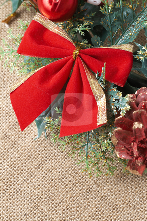 To use this stock image in your creative project, please select the size you need over to the right and click the "Add to Cart" button.
Your downloaded image will come with the Cutcaster watermark removed so don’t worry about the watermark you see on this page. Colorful Christmas wreath stock photo, Colorful Christmas wreath with red bow, balls and pine cones on brown mesh background by Elena Weber (nee Talberg)