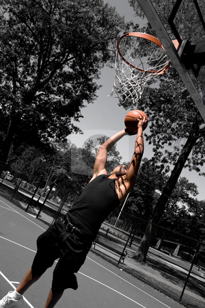 To use this stock image in your creative project, please select the size you need over to the right and click the "Add to Cart" button.
Your downloaded image will come with the Cutcaster watermark removed so don’t worry about the watermark you see on this page. Player Dunking stock photo, A young man driving to the basketball hoop for a dunk with selective color. by Todd Arena