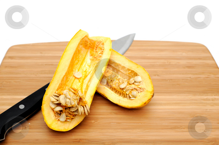 To use this stock image in your creative project, please select the size you need over to the right and click the "Add to Cart" button.
Your downloaded image will come with the Cutcaster watermark removed so don’t worry about the watermark you see on this page. Delicata Squash stock photo, Delicata squash sliced in half exposing the many seeds inside on a bamboo cutting board by Lynn Bendickson