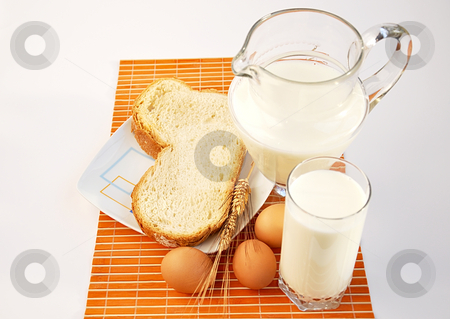 To use this stock image in your creative project, please select the size you need over to the right and click the "Add to Cart" button.
Your downloaded image will come with the Cutcaster watermark removed so don’t worry about the watermark you see on this page. Pitcher of milk, wheat, bread and eggs. stock photo, Pitcher of milk, wheat, bread and eggs. by Liana Bukhtyyarova