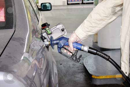 To use this stock image in your creative project, please select the size you need over to the right and click the "Add to Cart" button.
Your downloaded image will come with the Cutcaster watermark removed so don’t worry about the watermark you see on this page. At the petrol station. stock photo, Close-up of a man's hand using a petrol pump to fill his car up with fuel. by Liana Bukhtyyarova