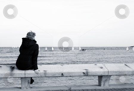 To use this stock image in your creative project, please select the size you need over to the right and click the "Add to Cart" button.
Your downloaded image will come with the Cutcaster watermark removed so don’t worry about the watermark you see on this page. Antibes #66 stock photo, Tourist sitting on a bench overlooking the sea in Antibes, France. Blue tone. Copy space. by Sean Nel