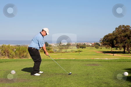 To use this stock image in your creative project, please select the size you need over to the right and click the "Add to Cart" button.
Your downloaded image will come with the Cutcaster watermark removed so don’t worry about the watermark you see on this page. Golfer #54 stock photo, A golfer playing golf on a green. by Sean Nel