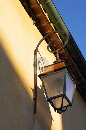 To use this stock image in your creative project, please select the size you need over to the right and click the "Add to Cart" button.
Your downloaded image will come with the Cutcaster watermark removed so don’t worry about the watermark you see on this page. Streetlight on the building stock photo, Streetlight against a building in Antibes, France. by Sean Nel