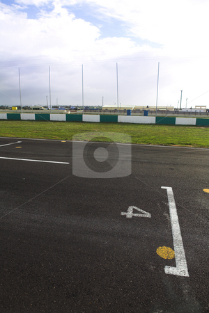 To use this stock image in your creative project, please select the size you need over to the right and click the "Add to Cart" button.
Your downloaded image will come with the Cutcaster watermark removed so don’t worry about the watermark you see on this page. Starting grid for racetrack stock photo, Starting grid in front of the pit lane of Killarney Race Track in the Western Cape, South Africa. Cloudy and wet race day. by Sean Nel