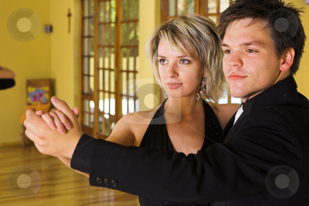 To use this stock image in your creative project, please select the size you need over to the right and click the "Add to Cart" button.
Your downloaded image will come with the Cutcaster watermark removed so don’t worry about the watermark you see on this page. Ballroom #3 stock photo, A couple dancing together in a studio - Focus on Woman by Sean Nel