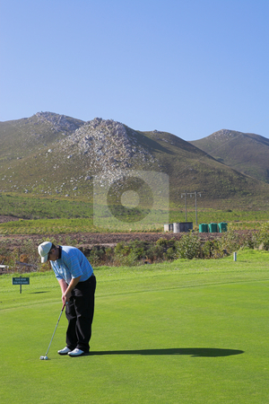 To use this stock image in your creative project, please select the size you need over to the right and click the "Add to Cart" button.
Your downloaded image will come with the Cutcaster watermark removed so don’t worry about the watermark you see on this page. Golfer #52 stock photo, A golfer playing golf on a green by Sean Nel